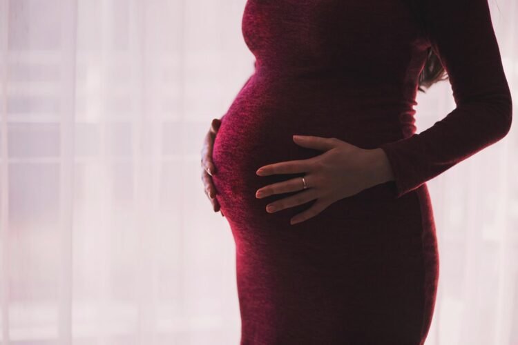 What happens if a woman becomes pregnant before completing the three doses?