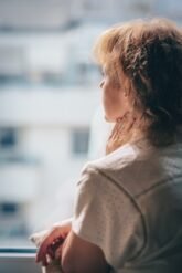 Do genital warts recur after treatment and how is it explained?