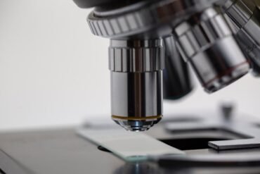 What can the examination of the cervical cells under the microscope show?
