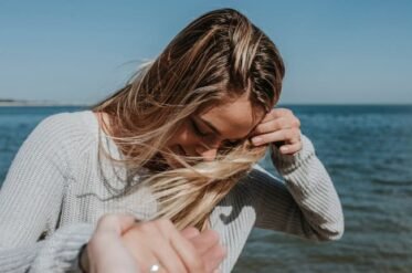 Can a woman who has undergone treatment become infected again by the same man?